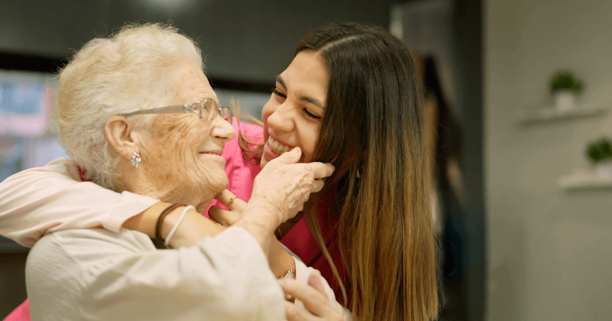 Adult granddaughter looking into grandmothers eyes for personalized memory care at Thrive.