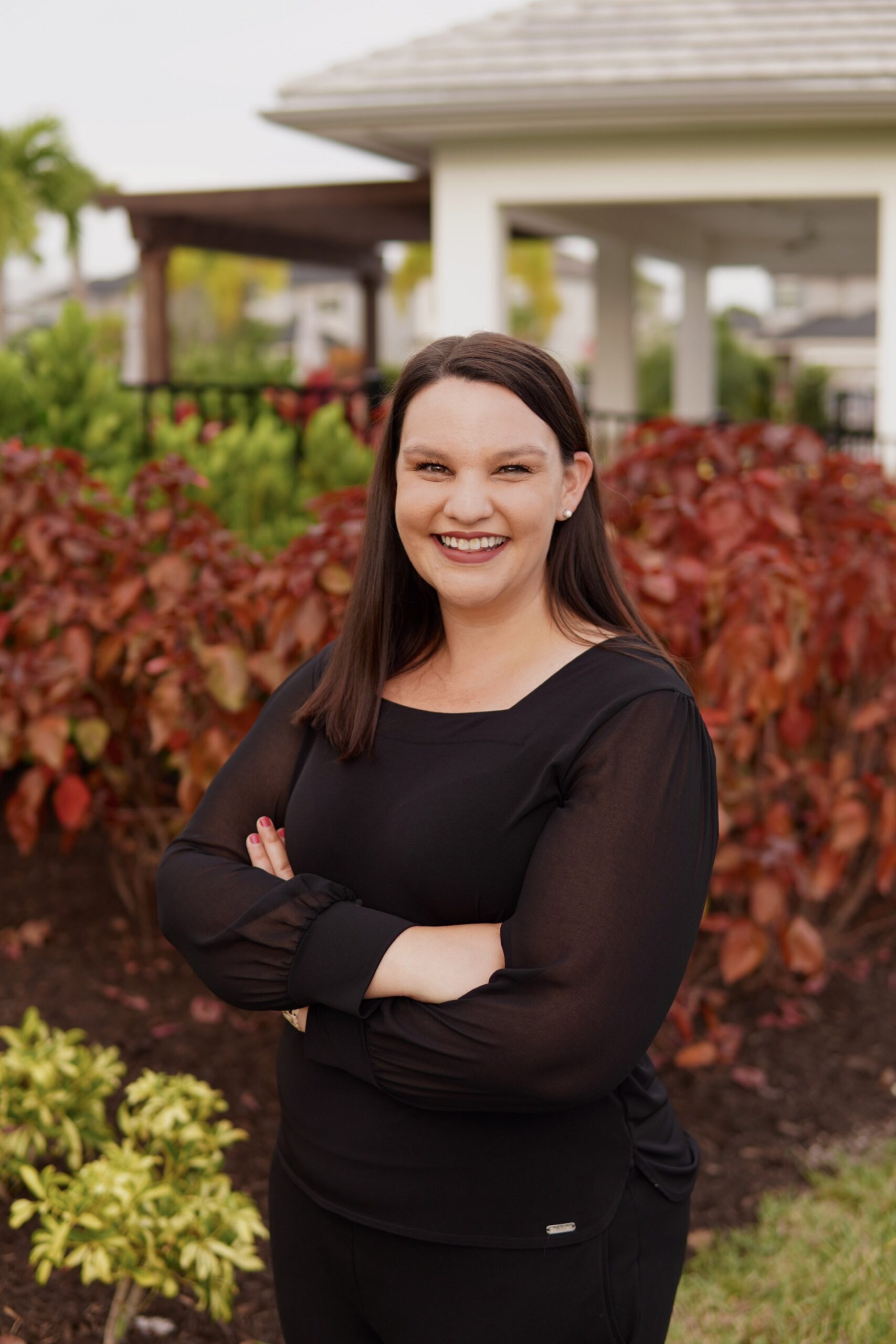 Headshot of Ashley Halmos smiling outdoors