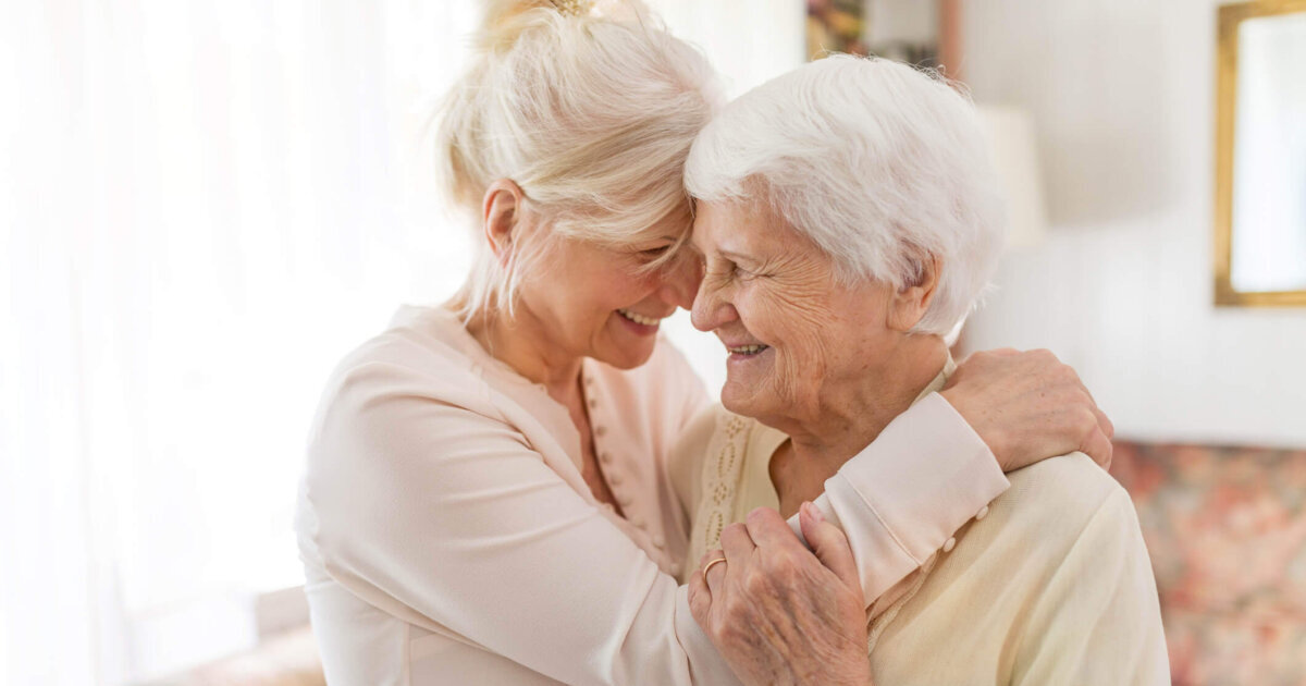 Navigating the Guilt of Moving a Loved One to Assisted Living Two elder woman embracing each other