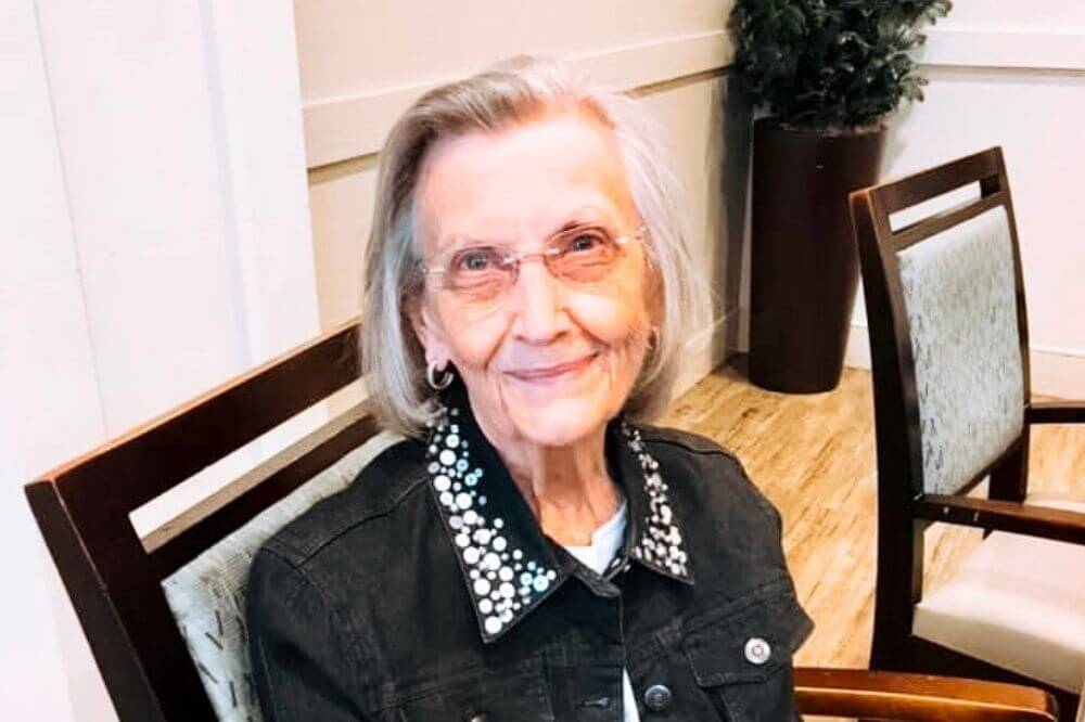 How to Pay for Senior Living FAQ, smiling woman