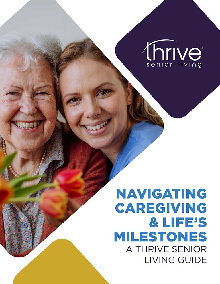 Smiling older woman and younger caregiver pose together holding flowers, with "Navigating Caregiving & Life's Milestones: A Thrive Senior Living Guide" text on the image, highlighting the support offered by Thrive Senior Living.