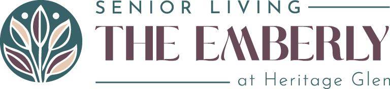 Logo for The Emberly Senior Living at Heritage Glen, managed by Thrive Senior Living, featuring stylized text and a leaf design in teal, purple, and beige.